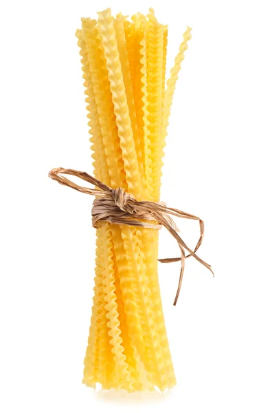 Raw pasta bunch composition bound with straw, isolated on white — Stock Photo, Image