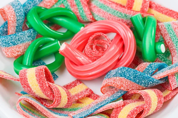 Dulces gomosos multicolores (regaliz) primer plano fondo de los alimentos — Foto de Stock