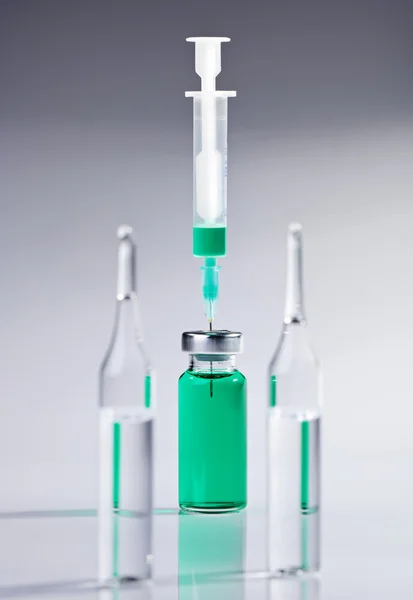 Ampoule and syringe macro still life on white — Stock Photo, Image