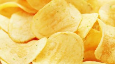 roterende aardappels, chips, de achtergrond van de voeding van de weergave van de macro