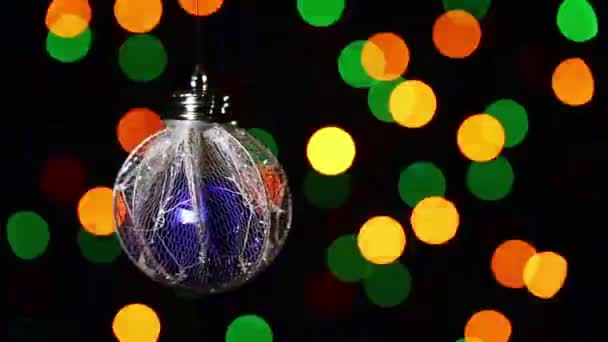 New Year decorations ball on blinking multicolor circles bokeh background — Stock Video