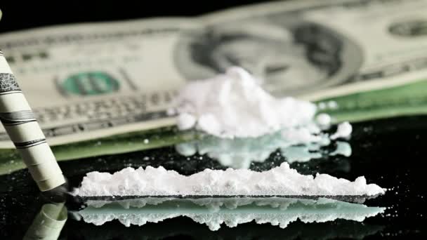 Cocaine snorted on a mirror through rolled 100 dollar bank note — Stock Video