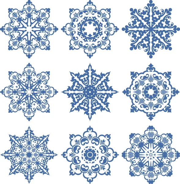 Set de 9 elementos decorativos o copos de nieve — Vector de stock