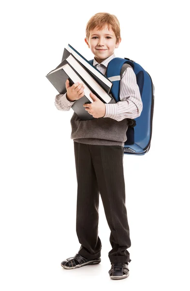 Школьник с рюкзаком с книгами в руках — стоковое фото