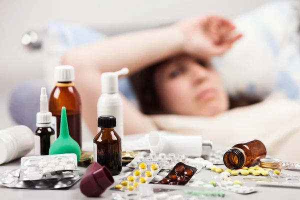 Unwell woman patient lying down bed — Stock Photo, Image
