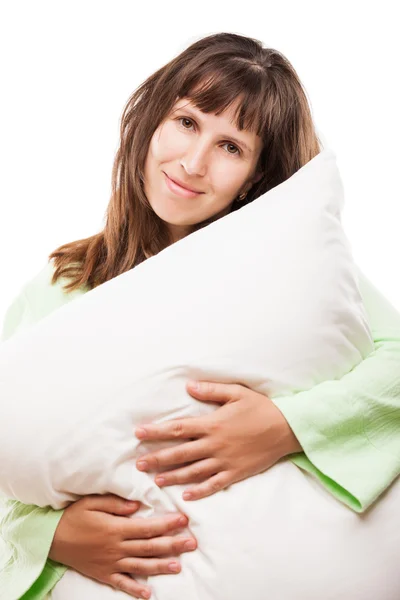 Belleza sonriente mujer sosteniendo almohada para descansar y dormir —  Fotos de Stock