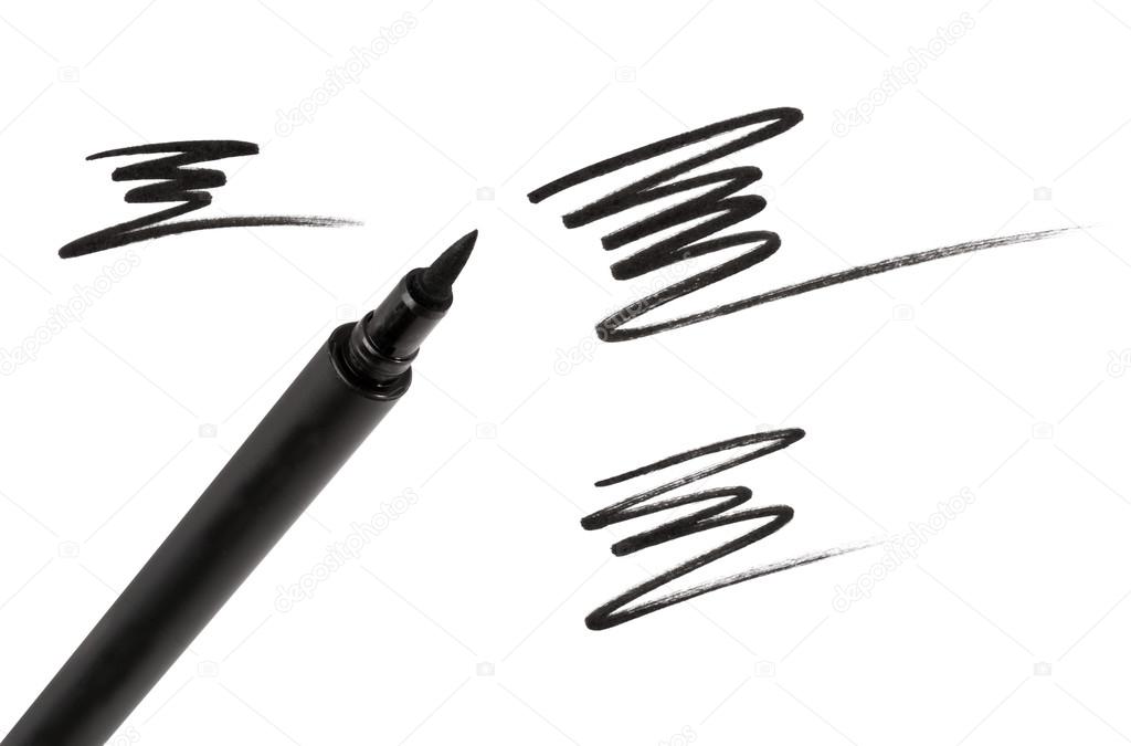 Cosmetic eyeliner with sample strokes isolated on white.