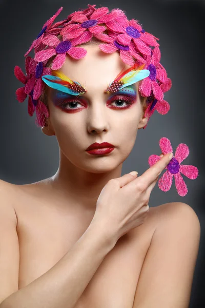 Portrait with flowers and feathers — Stock Photo, Image