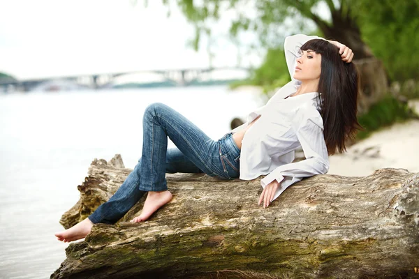 Young female on a beam — Stock Photo, Image