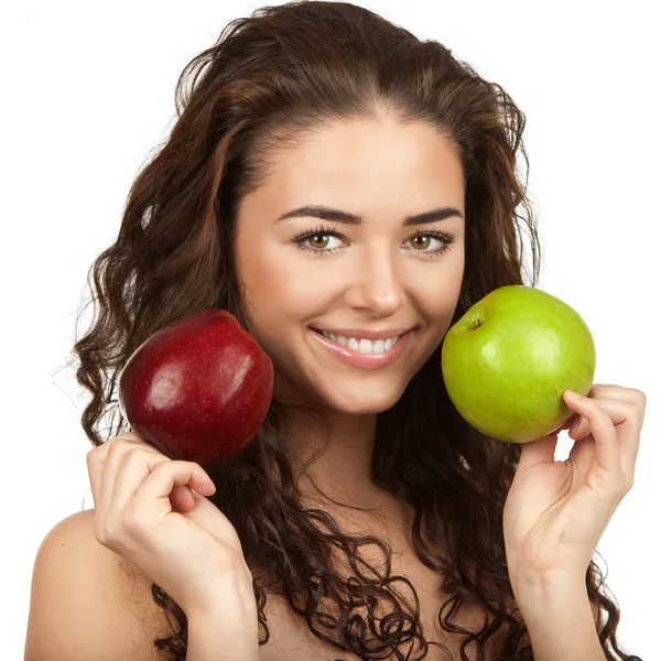 Hermosa morena sosteniendo manzanas — Foto de Stock