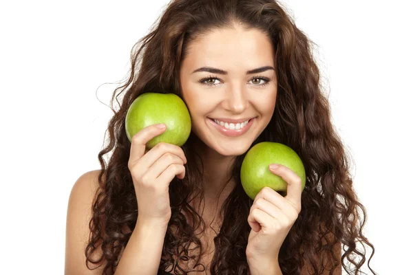 Beautiful brunette holding apples — Stock Photo, Image