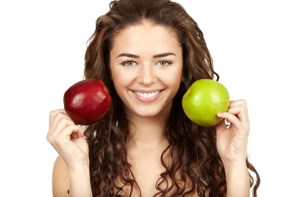 Beautiful brunette holding apples — Stock Photo, Image