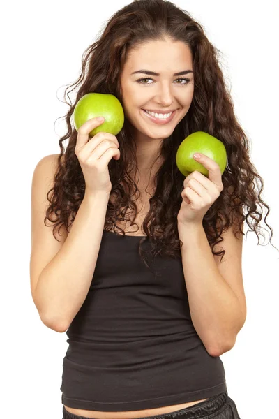 Beautiful brunette holding apples — Stock Photo, Image