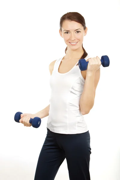 Young brunette woman with dumbells — Stock Photo, Image