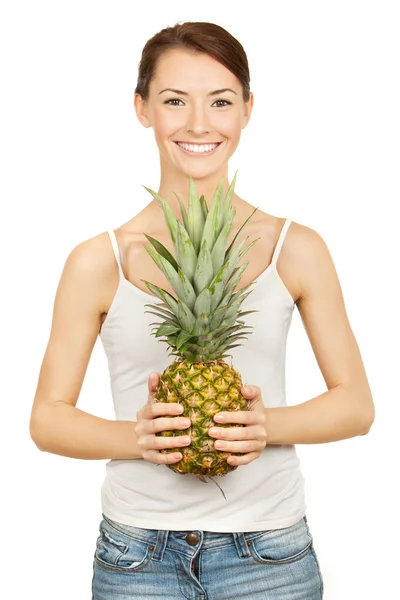 Beautiful brunette holding pineappl — Stock Photo, Image