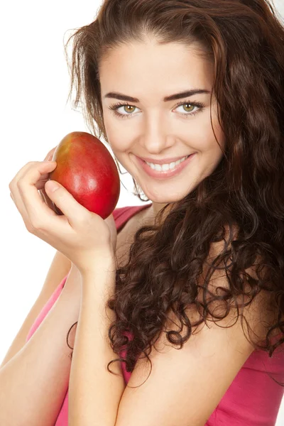 Beautiful brunette woman holding mango — Stock Photo, Image