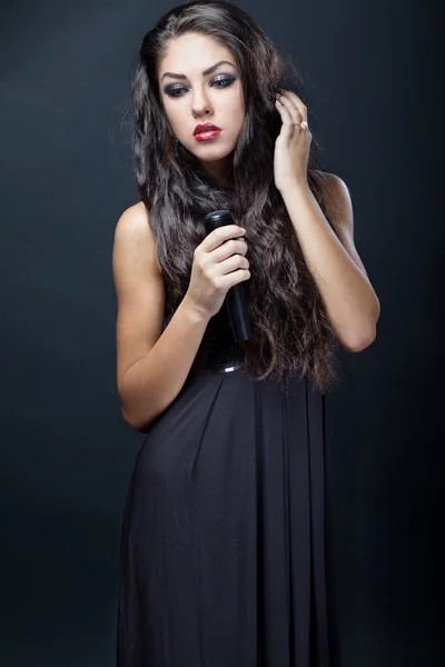 Beautiful young woman singer — Stock Photo, Image