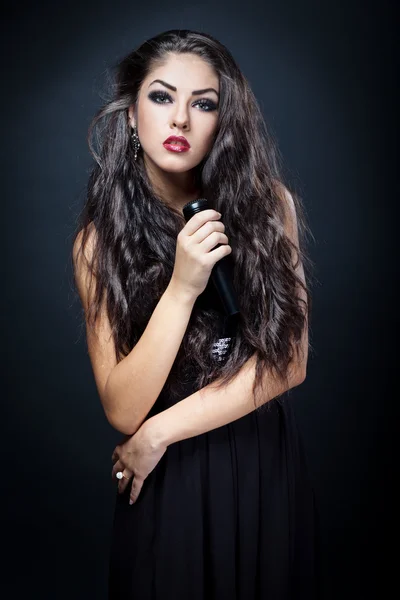 Beautiful young woman singer — Stock Photo, Image