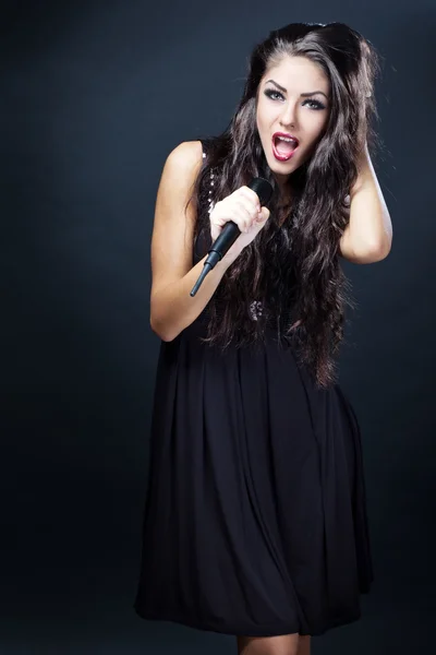 Beautiful young woman singer Stock Image