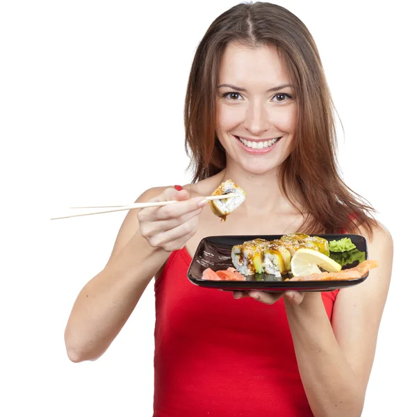 Mulher morena bonita comer sushi — Fotografia de Stock