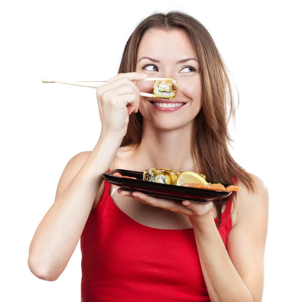 Beautiful brunette woman holding sushi — Stock Photo, Image
