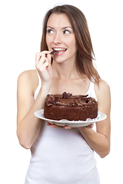Krásná bruneta žena jíst čokoládový dort — Stock fotografie