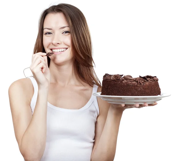 チョコレート ケーキを食べて美しいブルネットの女性 — ストック写真