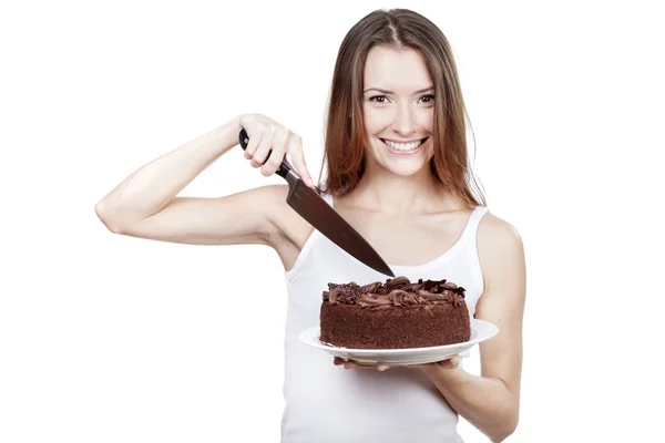 若い女性がケーキの一部をカットするつもりです。 — ストック写真