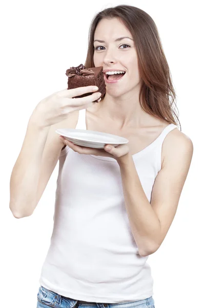 Beautiful young woman eating chocolate cake — Stock Photo, Image