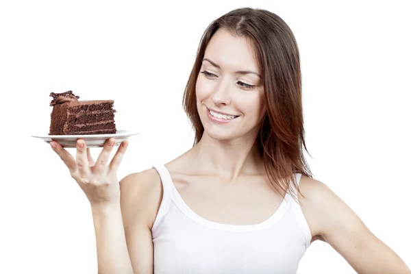 Young woman holding piece of chocolate cake — Stock Photo, Image