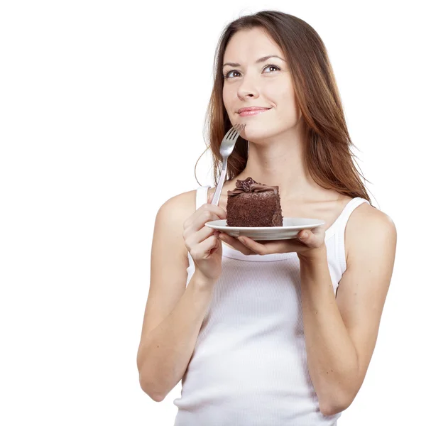 Mladá žena drží kus čokoládového dortu — Stock fotografie