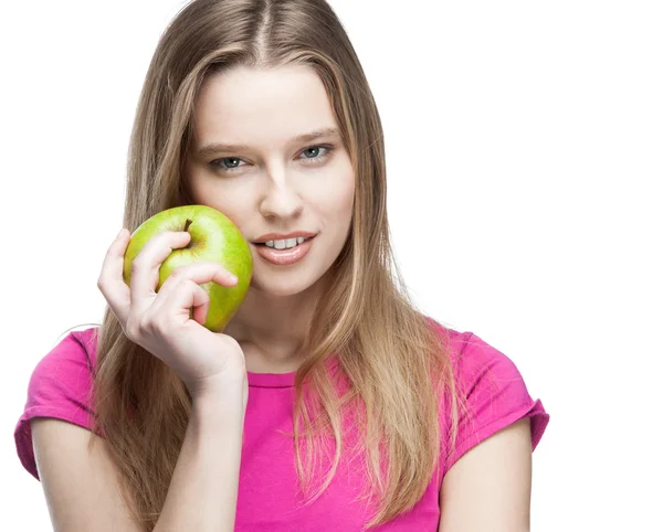 Young beautiful blond woman holding green apple — Stock Photo, Image