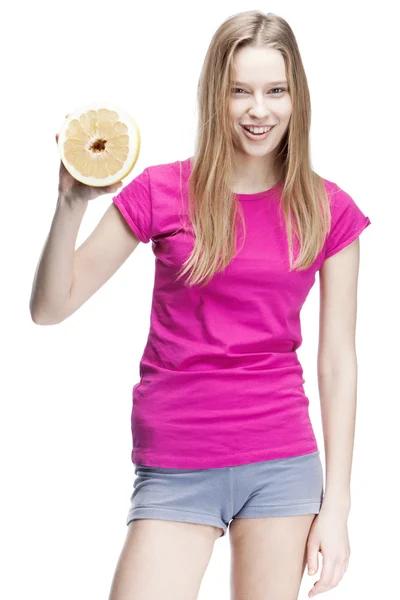 Young beautiful blond woman holding pomelo — Stock Photo, Image