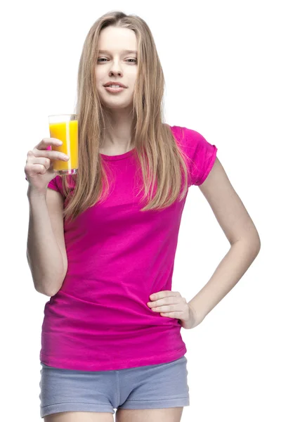 Young beautiful blond woman drinking orange juice — Stock Photo, Image