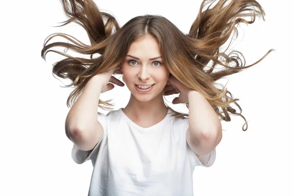 Mujer joven divertida con el pelo volador —  Fotos de Stock