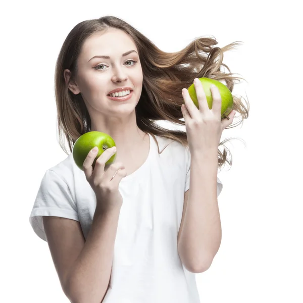 Mujer joven con dos manzanas verdes —  Fotos de Stock