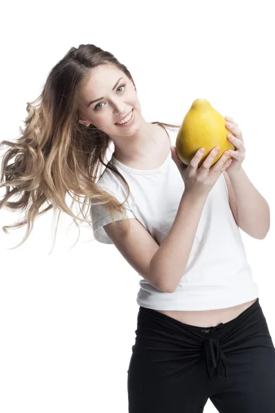 Young beautiful brunette woman holding pomelo — Stock Photo, Image