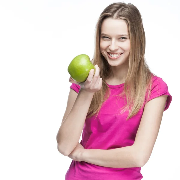 Young beautiful blond woman holding green apple — Stock Photo, Image