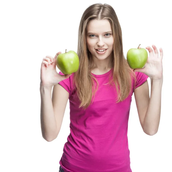 Young woman holding two green apples — Stock Photo, Image