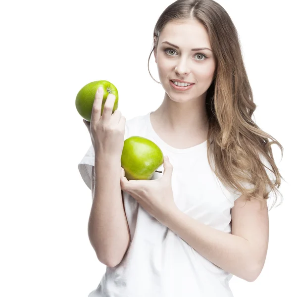 Jovem com duas maçãs verdes — Fotografia de Stock
