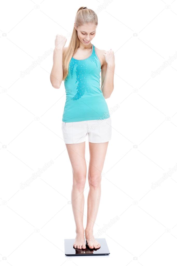 Dinkarville opschorten Diversen Jonge blonde vrouw permanent op schalen ⬇ Stockfoto, rechtenvrije foto door  © repinanatoly #31607283