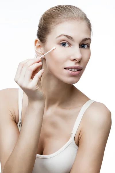 Young blond woman with cotton bud — Stock Photo, Image