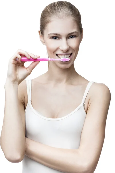 Happy young blond woman with toothbrush — Stock Photo, Image