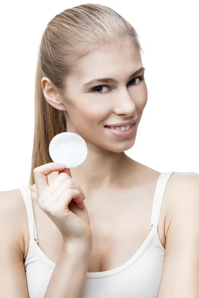 Young blond woman with cotton pad — Stock Photo, Image