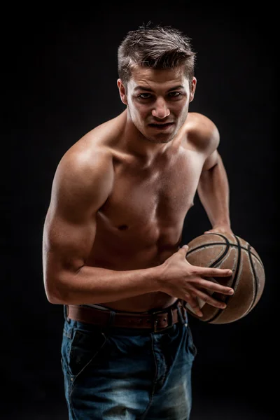 Young man on dark background — Stock Photo, Image