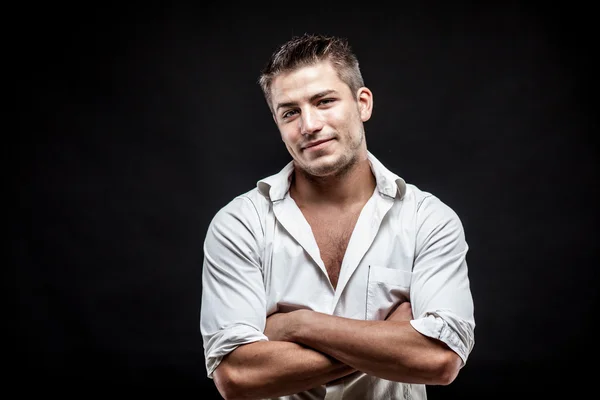 Young man on dark background — Stock Photo, Image