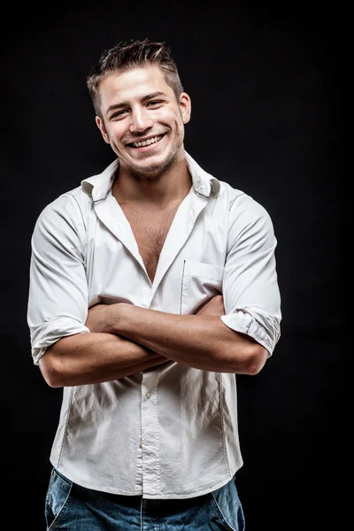 Young man on dark background — Stock Photo, Image