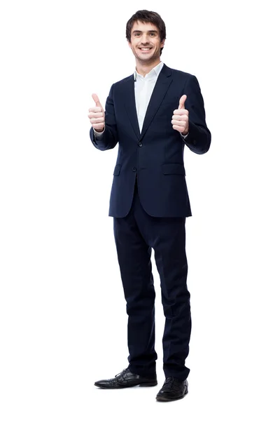 Hombre de negocios sonriente con el pulgar hacia arriba — Foto de Stock