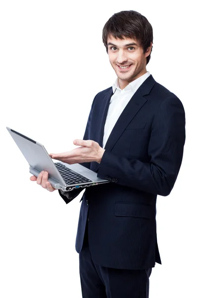 Молодой бизнесмен использует ноутбук на белом фоне . — стоковое фото