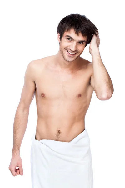 Happy young man with the towel around his waist — Stock Photo, Image